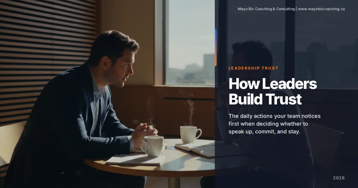 Leader having a calm, honest conversation with a team member in a warm office setting