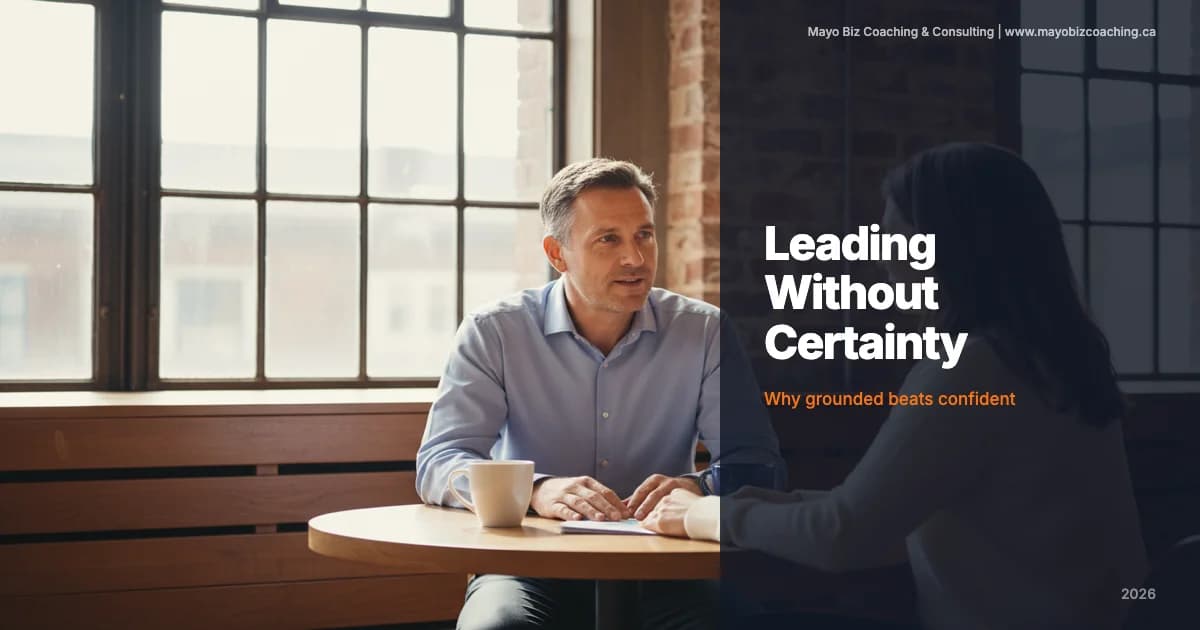 Business leader having an honest conversation with a team member in a warm office with morning light