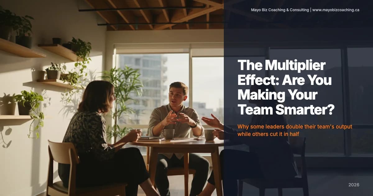 Business leader listening to a team member share ideas in a warm modern office with natural light