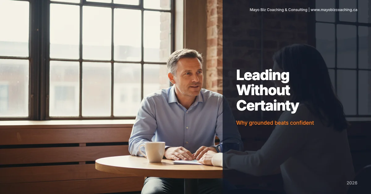 Business leader having an honest conversation with a team member in a warm office with morning light