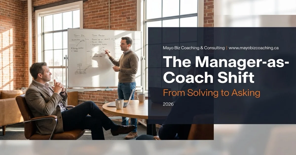 Manager listening while team member works through a problem on a whiteboard in a warm modern office