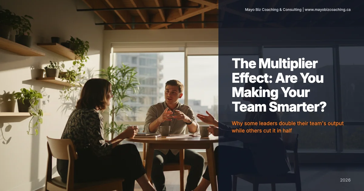 Business leader listening to a team member share ideas in a warm modern office with natural light